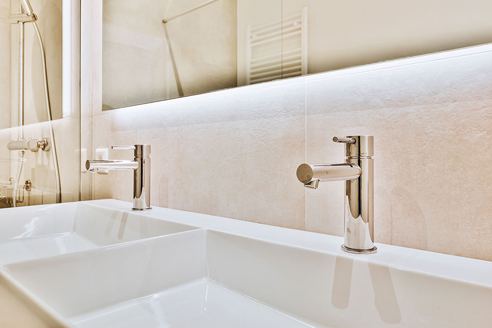 shiny-taps-over-sinks-in-bathroom-2021-10-21-02-45-12-utc